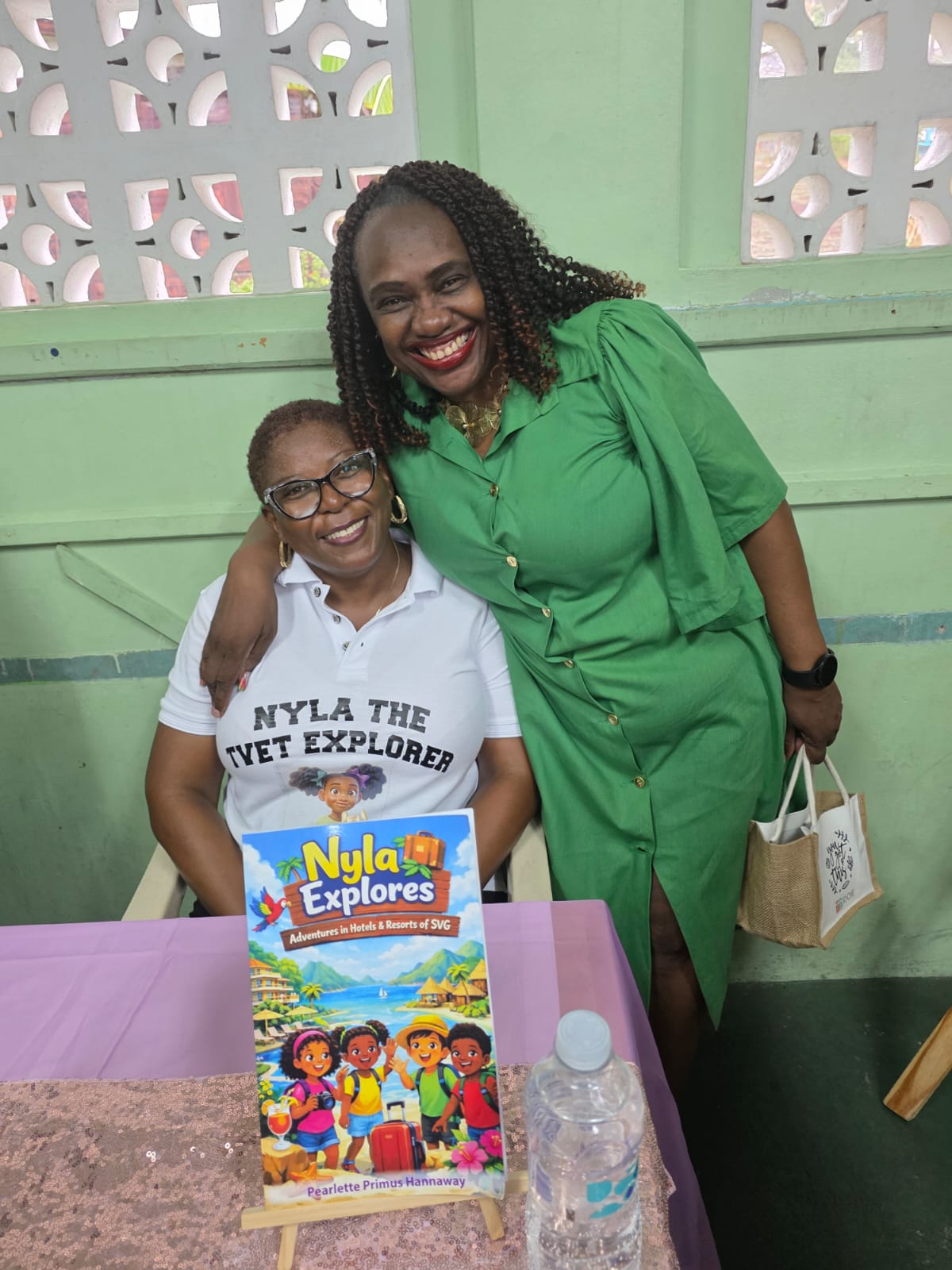 Pearlette with a reader beside the Nyla Explores book